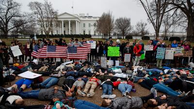 Demonstrators participate in a 'lie-in' during a protest in favor of gun control reform in front of the White House. AP Photo/Evan Vucci