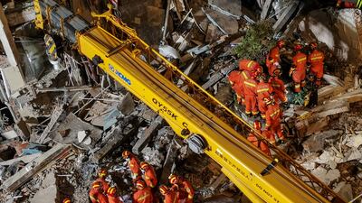 Rescuers searching at the site of a hotel after it collapsed leaving at least one dead and 10 others missing in the city of Suzhou in China's eastern Jiangsu province.