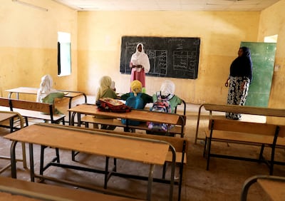 A teacher gives a lesson at a school in Khartoum. Reuters