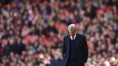 Arsenal manager Arsene Wenger hangs his head during his side's 1-1 draw with Crystal Palace on Sunday in the Premier League. Tony O'Brien / Action Images / Reuters / April 17, 2016