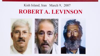 An FBI poster showing a composite image of former FBI agent Robert Levinson. On the right, there is a picture of how he would look like now after five years in captivity, and an image, centre, taken from the video, released by his kidnappers, and a picture before he was kidnapped, left. AP Photo