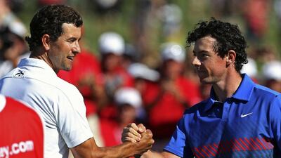 Rory McIlroy, right, overcame Adam Scott, left, to win the Australian Open on Sunday. Steve Christo / Reuters