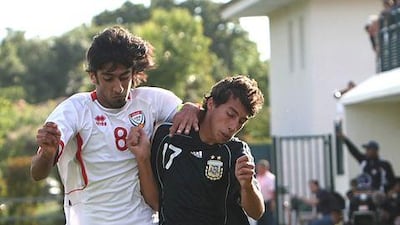 Hamdan al Kamali, left, seen here challenging Argentina U21's midfielder Lucas Trecarichi, may get the chance to play for the UAE against Argentina's senior side if the FA secure the prestige friendly they hope for.