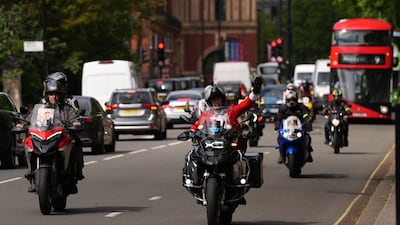 Campaigning motorcyclists ride past the Iranian embassy to London's Parliament Square. PA Wire.