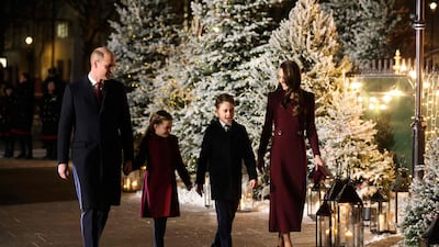 Prince William, his wife Kate, Princess Charlotte and Prince George arrive at the carol service. AFP