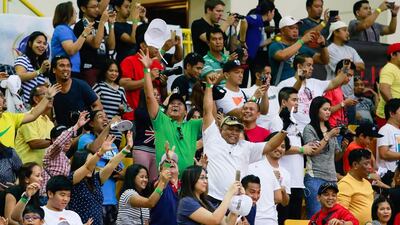 Manny Pacquiao’s fans get free caps at the Al Wasl Sports Club. Victor Besa for The National