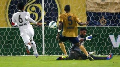 Simon Pierre Feindouno, centre, Dubai's only foreign player last nights, scored the first goal of the match. Jake Badger for The National