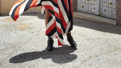 Sunburst: Skirt, Dh2,740, SemSem, blouse, Dh1,800, Alexandrine L’Amor, jacket Dh3,495, Racil at Matches.com, boots, Dh6,350, Gucci, turban, stylists own.