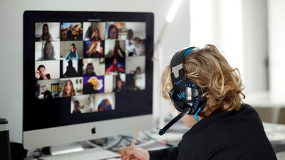 A student takes online classes at home, with his companions, using the Zoom APP during the coronavirus outbreak. REUTERS