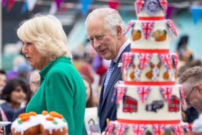 Prince Charles and Camilla Duchess of Cornwall examine jubilee cakes at the Oval Kennington cricket ground. Street and garden parties across the UK have celebratd Queen Elizabeth II's platinum jubilee. EPA