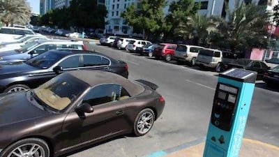 Cars parked near 30th and Corniche Road in a Mawaqif car park. Drivers complain that despite paying for permits, they can't get a park.