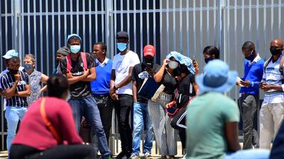 People queue outside a government office in Port Elizabeth, South Africa, a province badly affected by Covid. Inequalities and vulnerabilities will worsen as the effects of the pandemic disrupt any progress made on poverty and other sustainable development goals, said UNCTAD. Associated Press