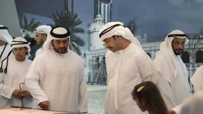 Sheikh Abdullah bin Zayed, Minister of Foreign Affairs (center R), and Sheikh Abdullah bin Mohamed bin Khaled Al Nahyan (center L), tour the Qasr Al Hosn exhibition. Ryan Carter / Crown Prince Court - Abu Dhabi