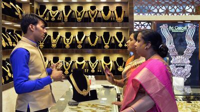 Indian customers look at gold jewellery at a stall in the Asia Jewels Fair 2017 in Bangalore this month. The Indian jeweller Titan aims to expand. Manjunath Kiran / AFP