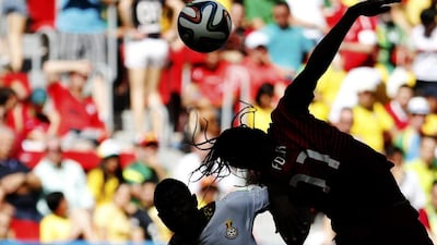 Portugal's Eder, right, and Ghana's Kwadwo Asamoah jump for the ball during their 2014 World Cup Group G match on Thursday in Brasilia, Brazil. Jorge Silva / June 26, 2014