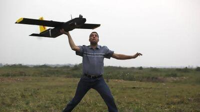Remo Peduzzi, managing director of ResearchDrones LLC Switzerland prepares to fly an unmanned aircraft at the Kaziranga National Park in Assam state, India.