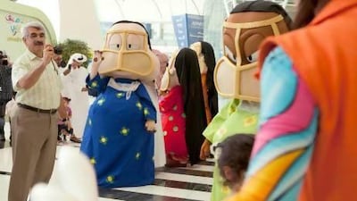 Cartoon characters, fairground rides and family entertainment were unveiled at Adnec yesterday ahead of today's opening of this year's SummerFest, which features games, arts and crafts and live shows. Razan Alzayani / The National
