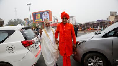 A Muslim cleric and a Hindu priest arrive to attend the inauguration ceremony. Reuters