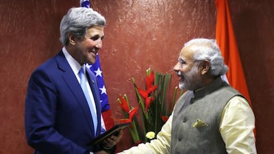 US secretary of state John Kerry shakes hands with Indian prime minister Narendra Modi on the sidelines of the Vibrant Gujarat conference in Ahmedabad on January 11, 2015. Rick Wilking, Pool/AFP Photo