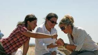 Left to right: Lorena Giorgio, Dr Sophie Mery and Dalia Gasparini examine the site.