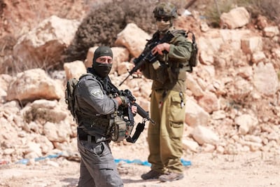 Israeli soldiers in the village of Qusra. AFP