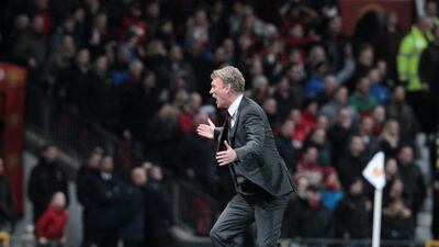Manchester United manager David Moyes runs onto the pitch to protest at referee Howard Webb's decision during a Premier League match against Tottenham Hotspur on Wednesday. Lindsey Parnaby / EPA
