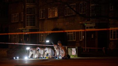 Police officers conduct a fingertip search of Poynders Road in London. Getty Images