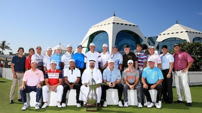 Past champions of the Dubai Desert Classic pose with vice chairman and CEO of Golf In Dubai Mohamed Juma Buamaim, centre, in front of the Emirates Golf Club on Monday before the Champions Challenge. The 25th edition of the Omega Dubai Desert Classic starts Thursday. David Cannon / Getty Images