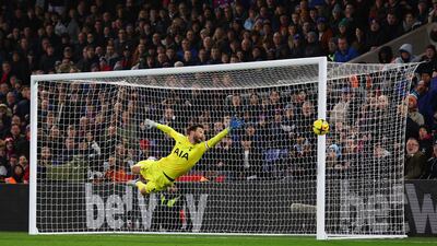 Tottenham goalkeeper Hugo Lloris watches a shot by Joachim Andersen fly wide for Palace. Reuters