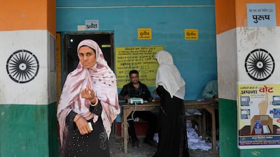 A woman displays the indelible ink mark on her finger after voting in the eastern Indian state of Bihar on Monday. India's ruling BJP party, instead of making the election a referendum on its own performance over the past decade, it is attempting to shift the focus to the opposition. AP