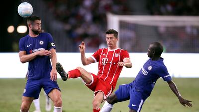 Bayern Munich's Robert Lewandowski in action against Chelsea's Gary Cahill and N'Golo Kante. Yong Tech Lim / Reuters