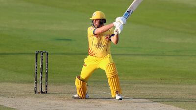 Team Abu Dhabi's Luke Wright goes for big hit. Chris Whiteoak / The National