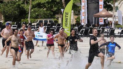 Swimmers hit the water for the Divers Down Dubai Finathon, a swimming challenge campaign to end shark finning, at Riva Beach Club in Dubai. Sarah Dea / The National