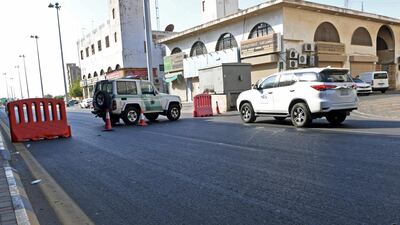 Saudi police close a street leading to a non-Muslim cemetery in the Saudi city of Jeddah where a bomb struck a First World War commemoration attended by European diplomats. AFP