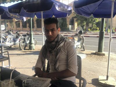Ahmad El Majdouli, 28, sits at a cafe in Marrakesh as he talks about his dream of leaving Morocco to find better-paying work. Federica Marsi / The National