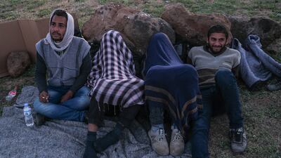 A group of Afghan and Iranian refugees rest next to the railway in Tatvan district in Bitlis city eastern province of Turkey.