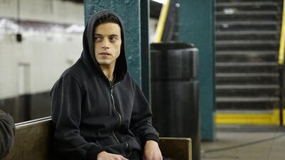 In this image released by USA Network, Rami Malek appears in a scene from, "Mr. Robot." On Thursday, July 14, 2016, Malek is nominated for outstanding actor in a drama series for his role. The 68th Primetime Emmy Awards will be broadcast live Sunday on ABC beginning at 8 p.m. ET on ABC. (Peter Kramer/USA Network via AP)