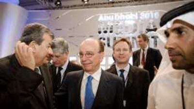 Rupert Murdoch, the chairman and managing director of News Corporation, centre, attends the opening night of the Abu Dhabi Media Summit with the chairman of Abu Dhabi Media Company, Mohamed Khalaf al Mazrouei, far right, yesterday.