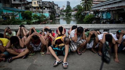 Drug suspects are rounded up at the Manila Islamic Centre in Manila on October 7, 2016, three months after Philippine president Rodrigo Duterte launched his war on drugs. Noel Celis / AFP