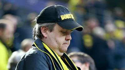 A fan of Dortmund’s football club at Signal Iduna Park. Christof Koepsel / Getty Images