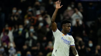 Real Madrid's Brazilian forward Vinicius Junior waves as he leaves the pitch. AFP