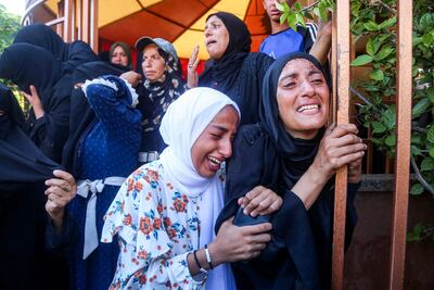 Mourners at the funeral of Palestinians killed on the previous day by Israeli air strikes at Nasser Medical Complex in Khan Younis in the southern Gaza Strip on July 20, 2025. AFP