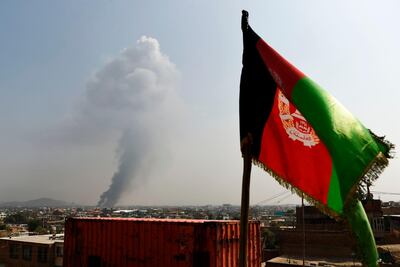 Smoke rises from the site of an attack after a massive explosion near the Green Village in Kabul, Afghanistan. AFP
