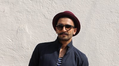 He opted for a casual look in red chinos, an open navy jacket and Breton tee in Mumbai in 2015. AFP