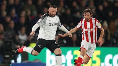 Derby County's Wayne Rooney, left, in action during their 4-0 win against Stoke City in the Championship on Friday. Reuters