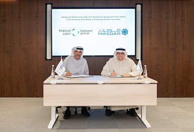 Ali Al Dhaheri, managing director and chief executive of Tadweer Group, left, and Mohamed Al Ramahi, chief executive of Masdar, during the signing ceremony. Wam