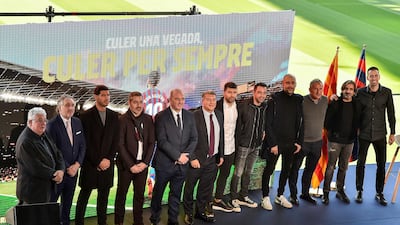 Sergio Aguero poses for a group picture with Barcelona players and management. AFP