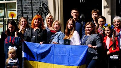 Ukrainian families outside 10 Downing Street in May. Campaigners want Prime Minister Liz Truss to make a public pledge that the accommodation and financial help on offer will continue. PA