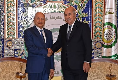 Algerian President Abdelmadjid Tebboune, right, welcomes the head of Yemen's presidential council, Rashad Al Alimi, in Algiers before of the opening of the Arab summit on November 1. AFP