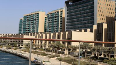 Al Muneera apartment properties in Al Raha Beach area in Abu Dhabi. Villas sit in front of the apartment complexes. Ravindranath K / The National